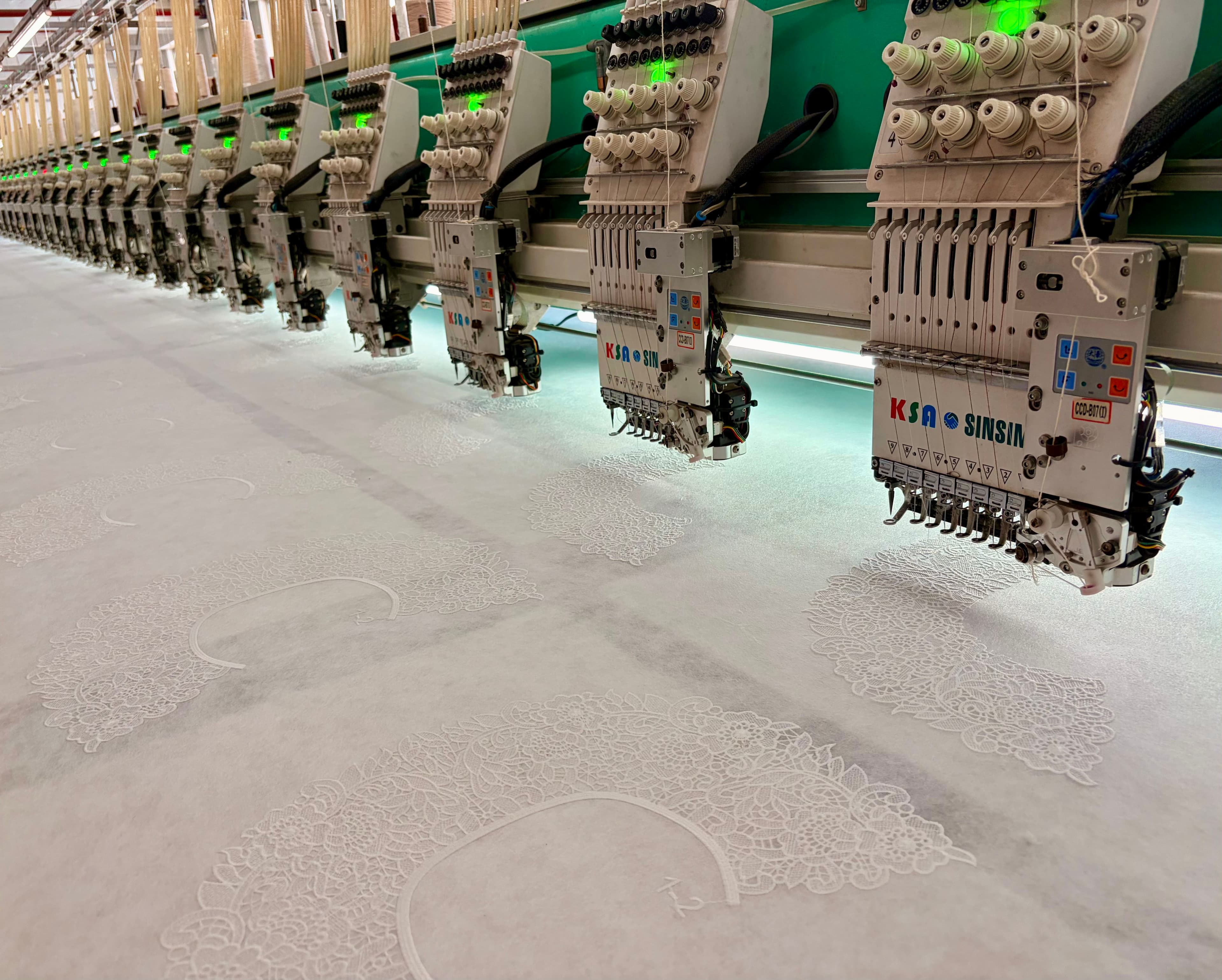 Multi-head embroidery production
